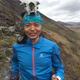 A little bit silly photo of Rai in the UK with a sheep skull on her skull. (Photo credit: Adam Briggs)